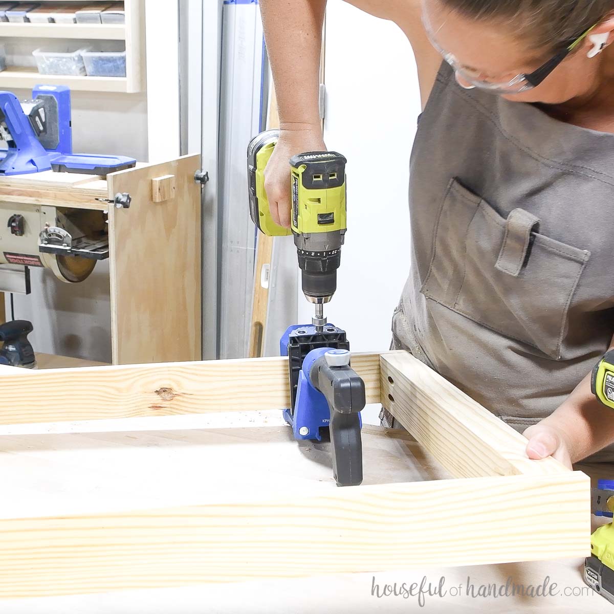 Drilling pocket holes in the top of the frame with a jig. 