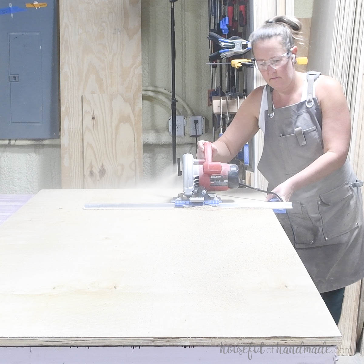 Ripping strips of plywood for the cabinet sides with  a circular saw. 