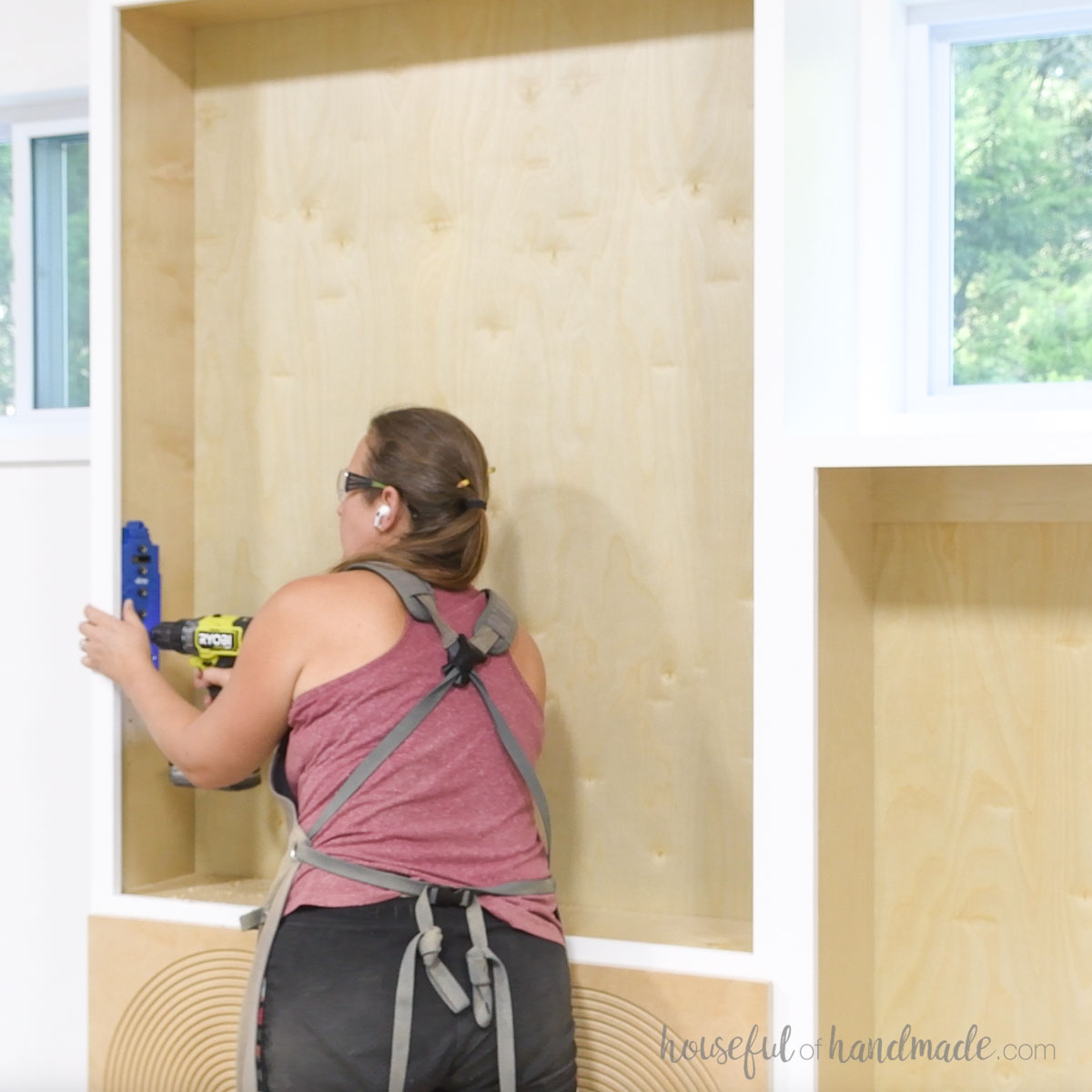 Drilling holes for shelf pins with a Kreg shelf pin jig. 