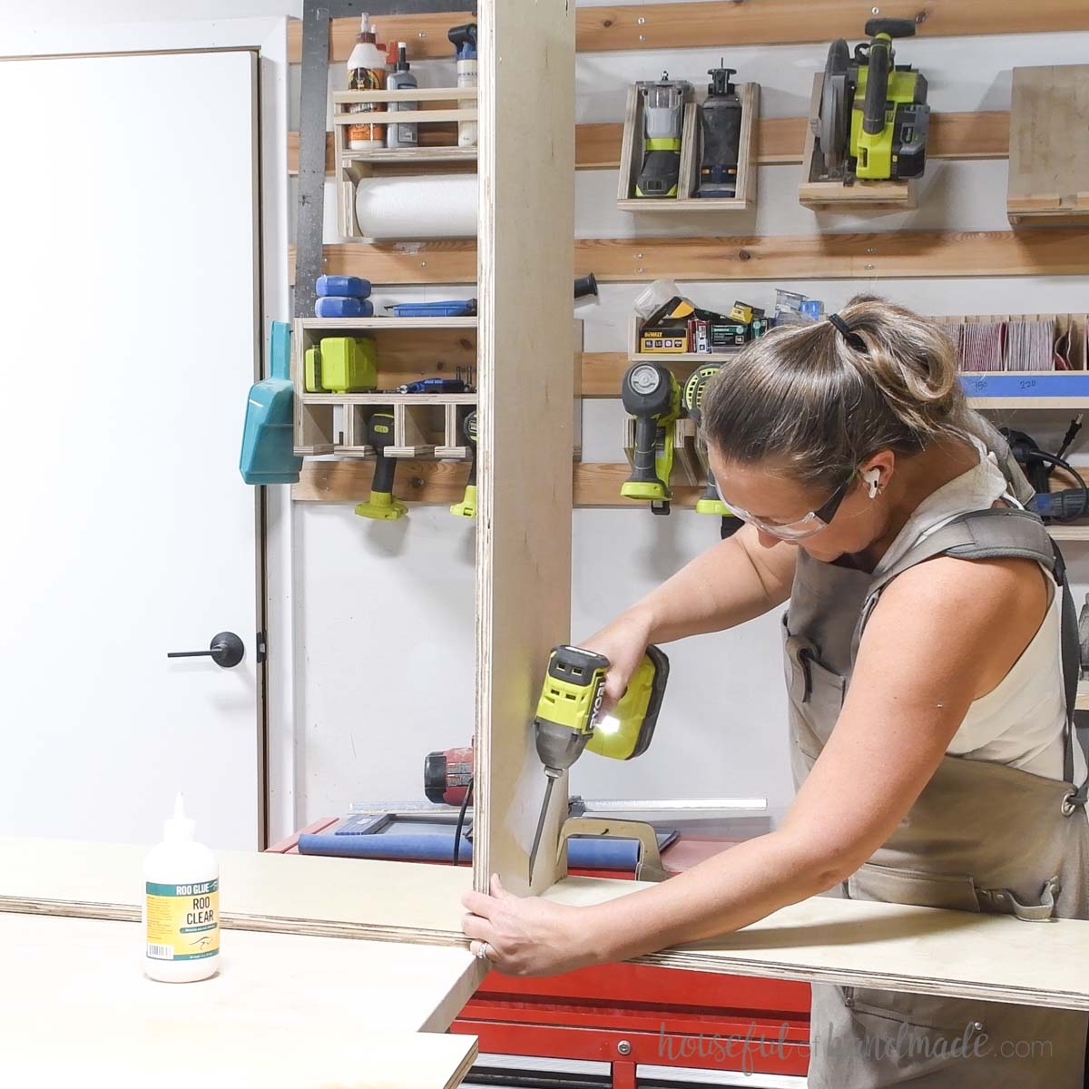 Attaching the center stationary shelf to the side. 