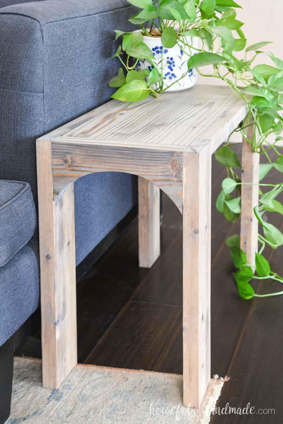 End table built from 2x boards with a washed or bleached wood look. 