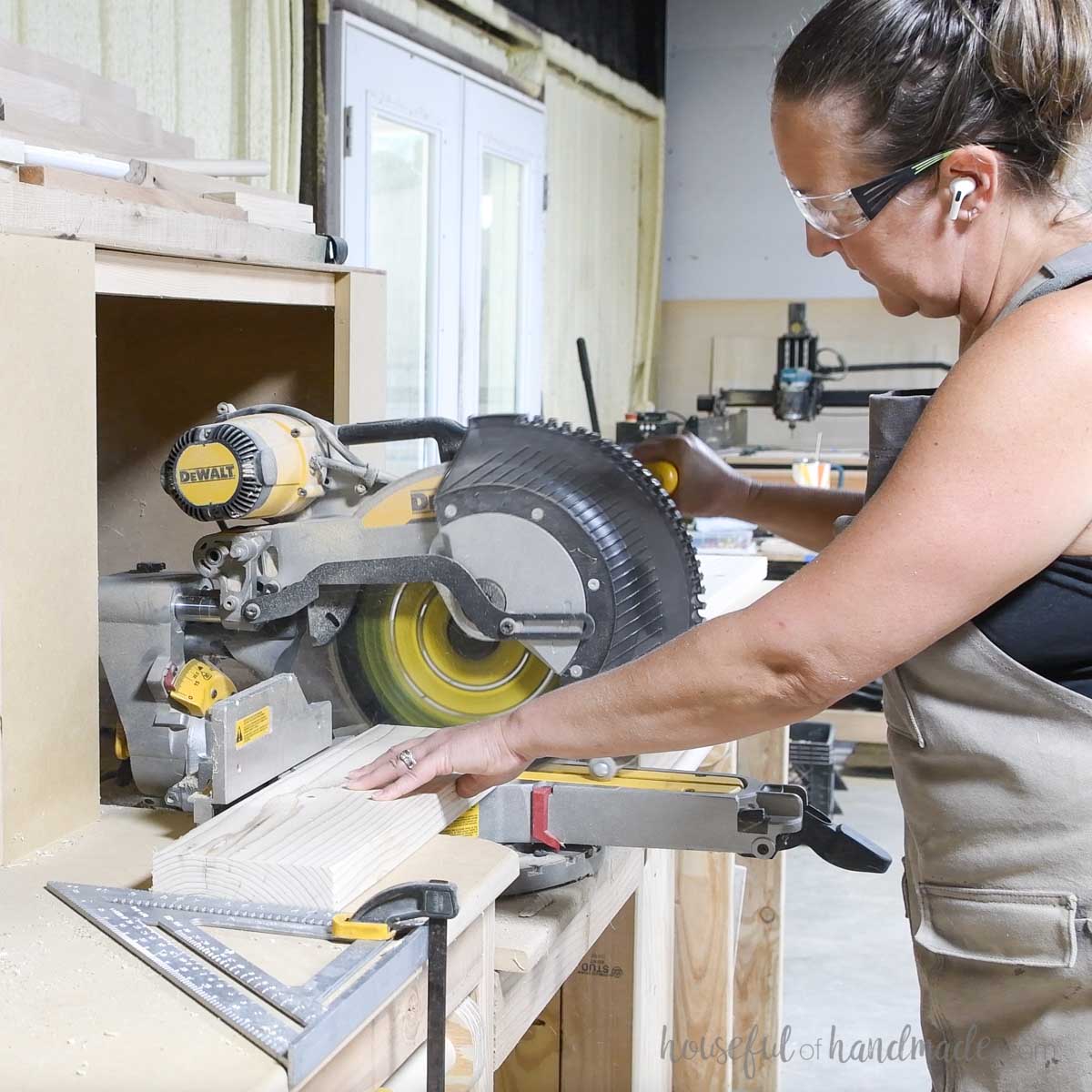 Cutting 2x6 boards on a miter saw.