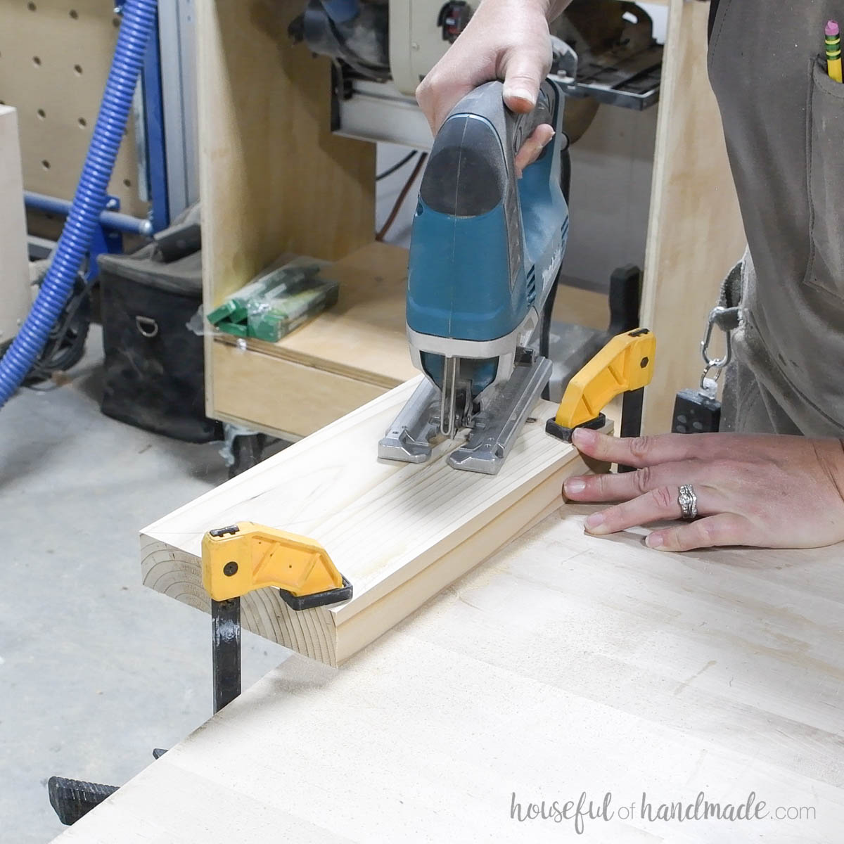 Cutting the 2x6 board with a jig saw. 