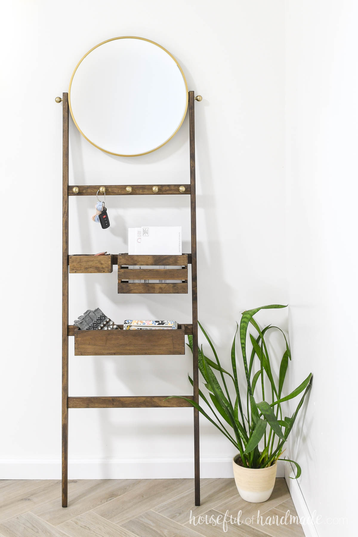 Storage ladder for the entryway with bins for mail, sunglasses and gloves. 