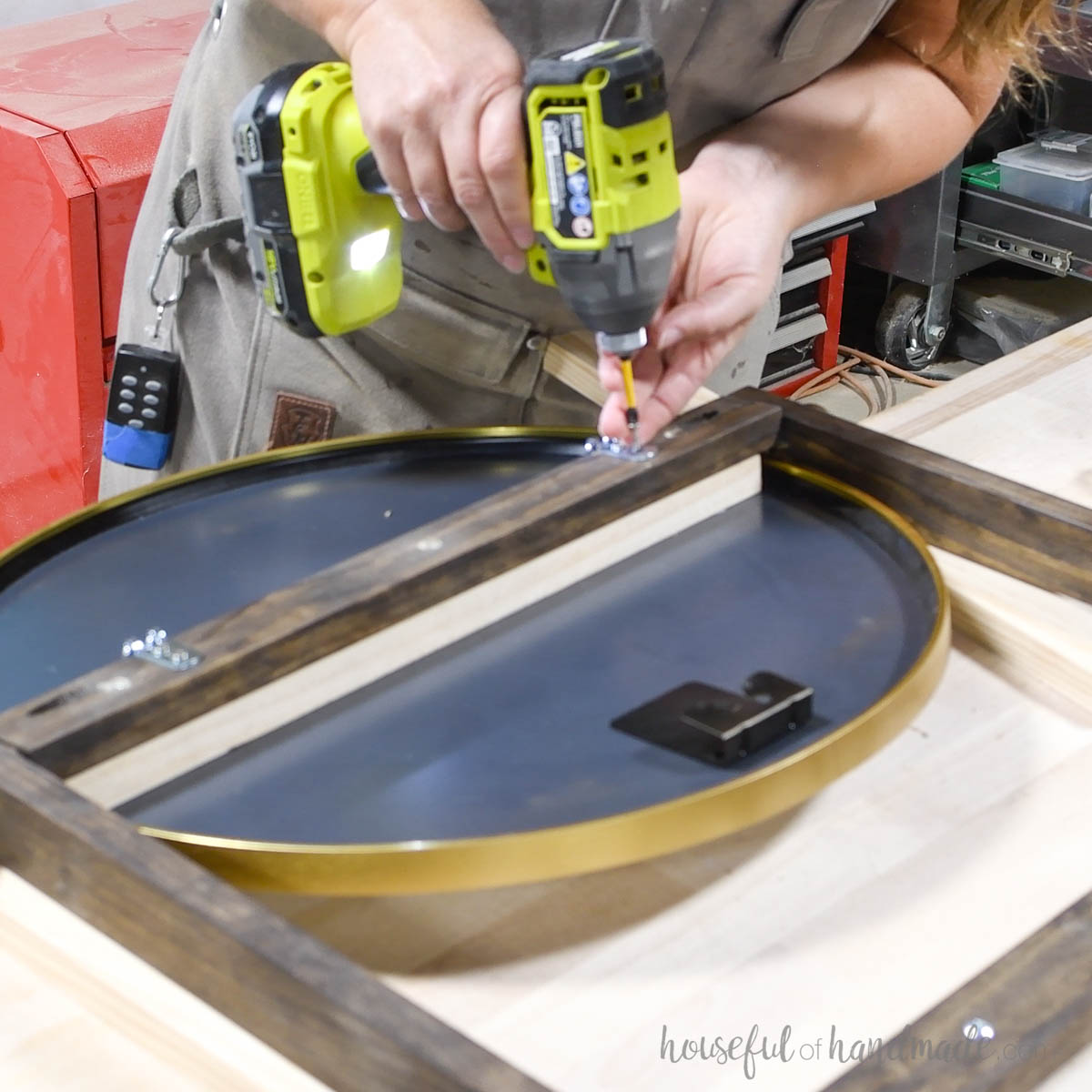 Attaching D-rings to the top of the ladder to secure to wall.