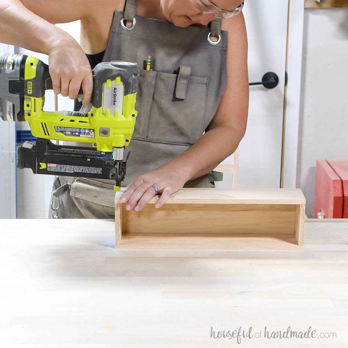 Attaching the front to the wood bin.