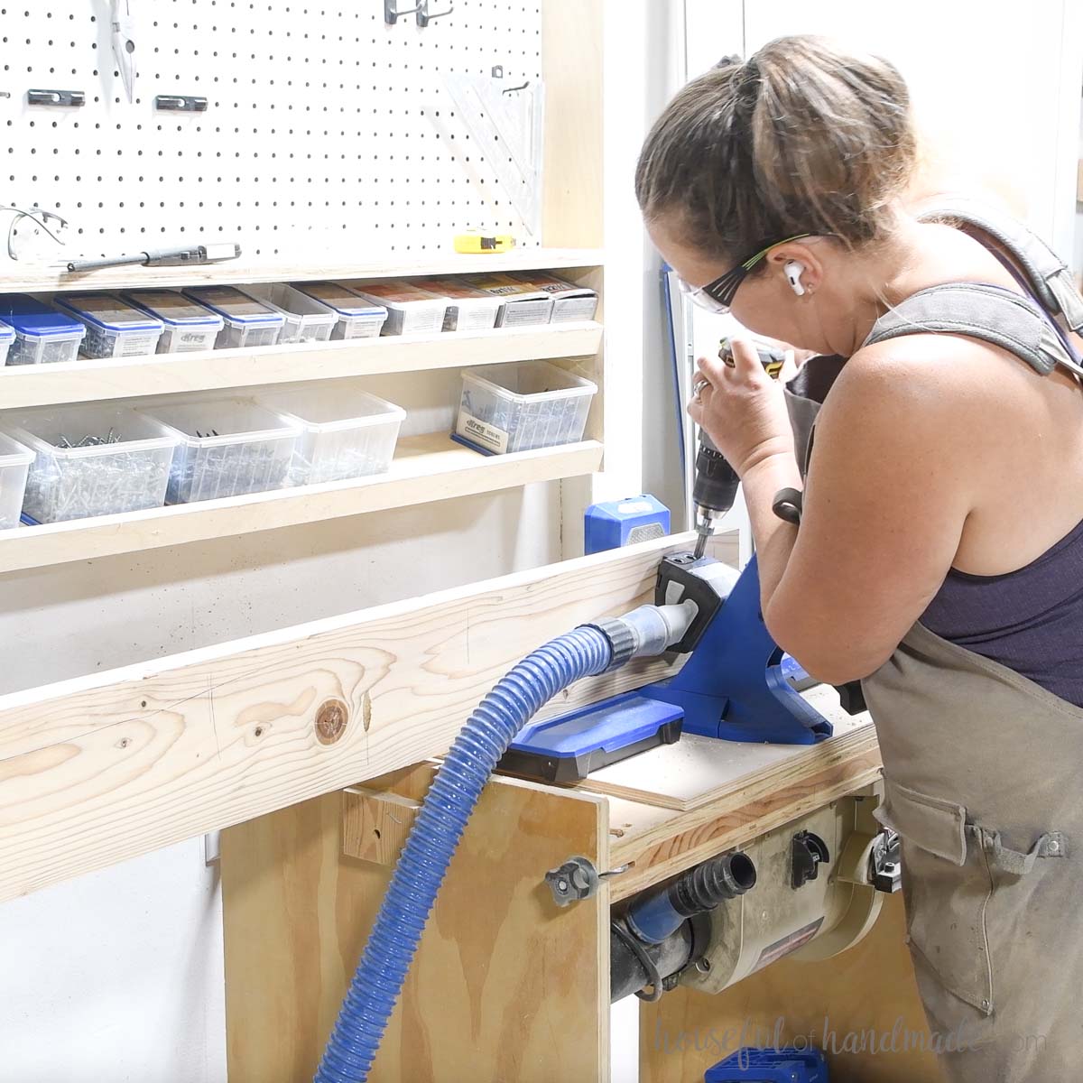 Drilling pocket holes along the length of a 2x6 board. 