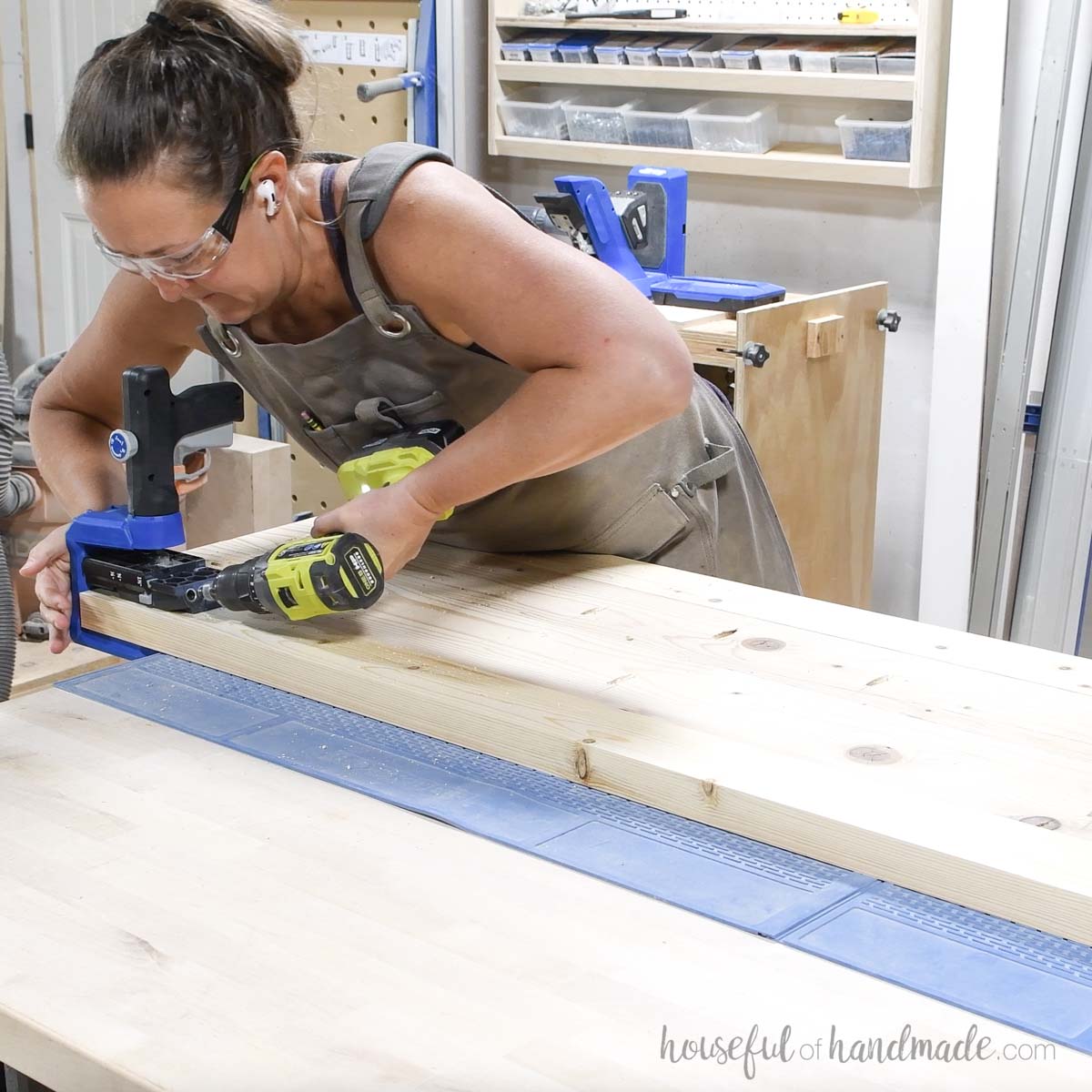 Drilling pocket holes in the end of the assembled coffee table top. 