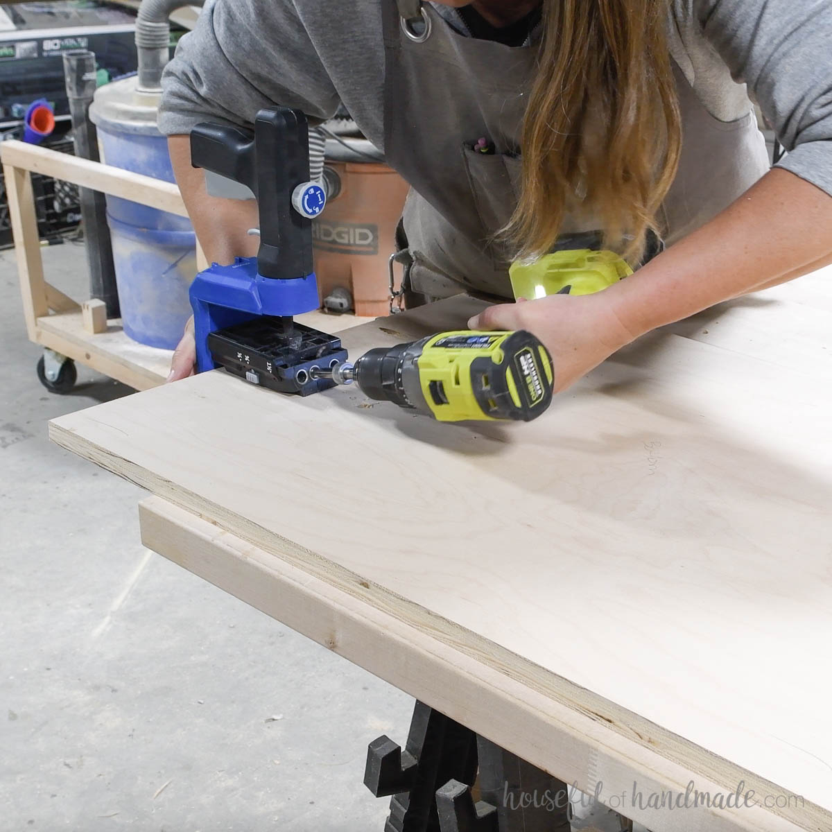 Drilling pocket holes in a piece of plywood with a Kreg 520Pro jig. 