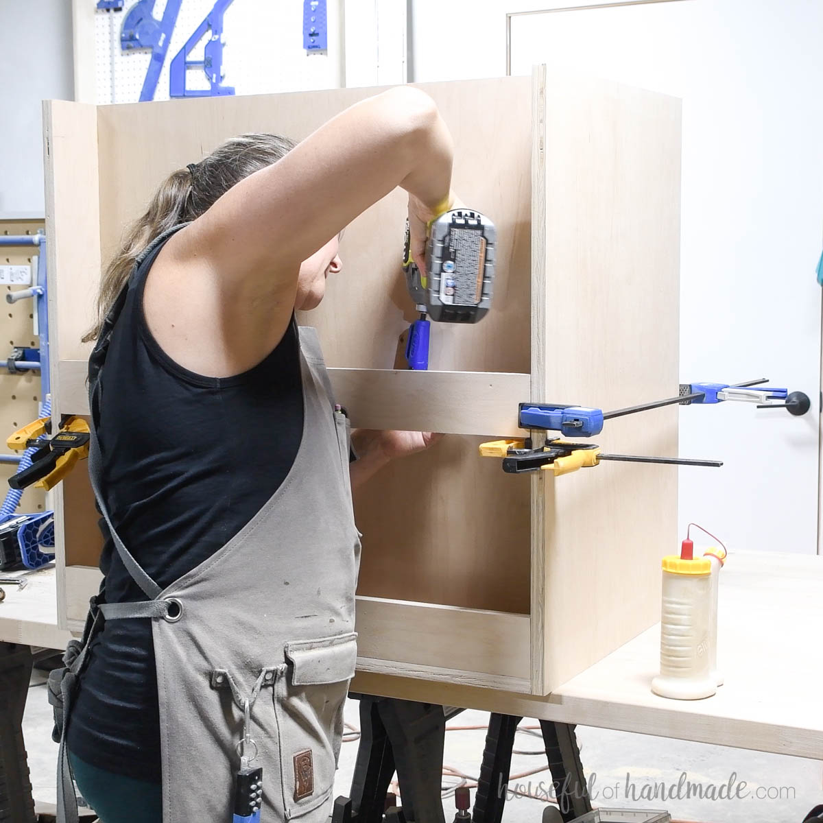 Attaching slats to the back for wrapping paper storage. 