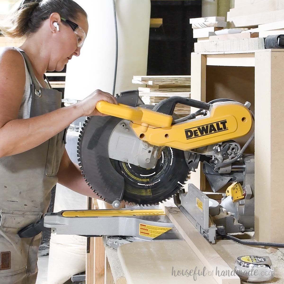 Cutting a 1x2 board on a miter saw. 