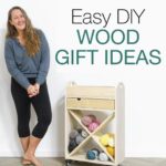 Kati standing next to wood craft stand with words Easy DIY Wood Gift Ideas next to it.