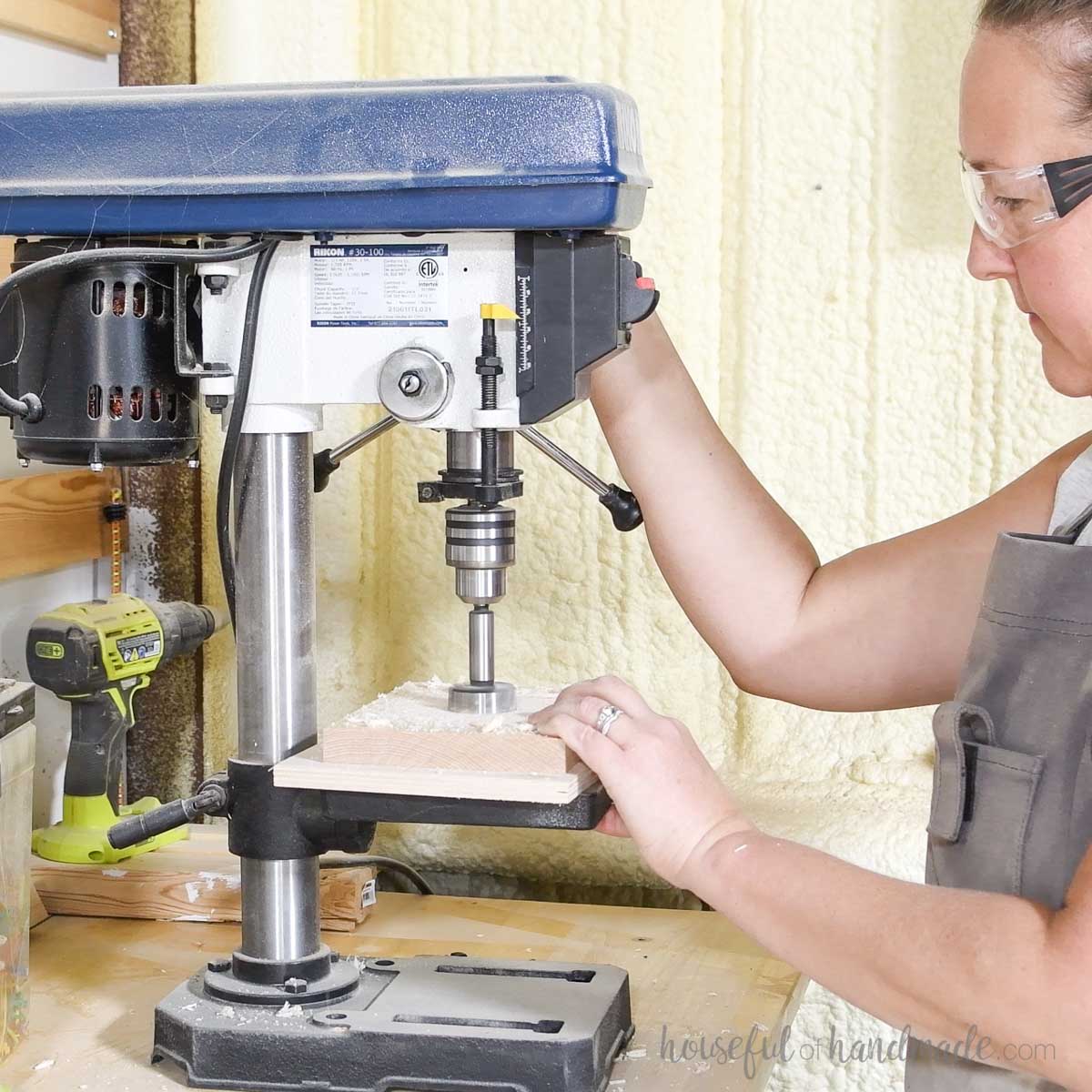 Drilling a large hole through the center with a drill press. 