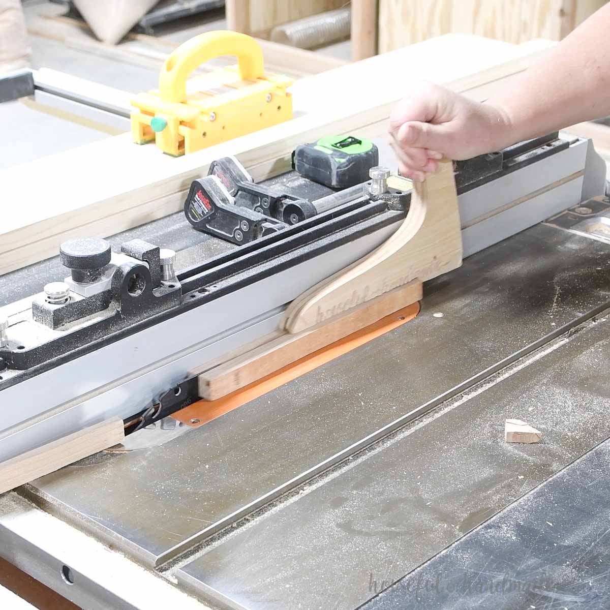 Cutting 1/4" thick strips of wood on the table saw. 