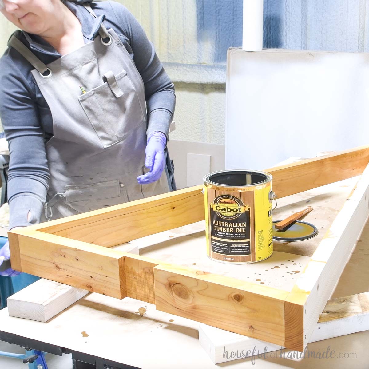 Staining the wood tree pieces with outdoor sealer. 