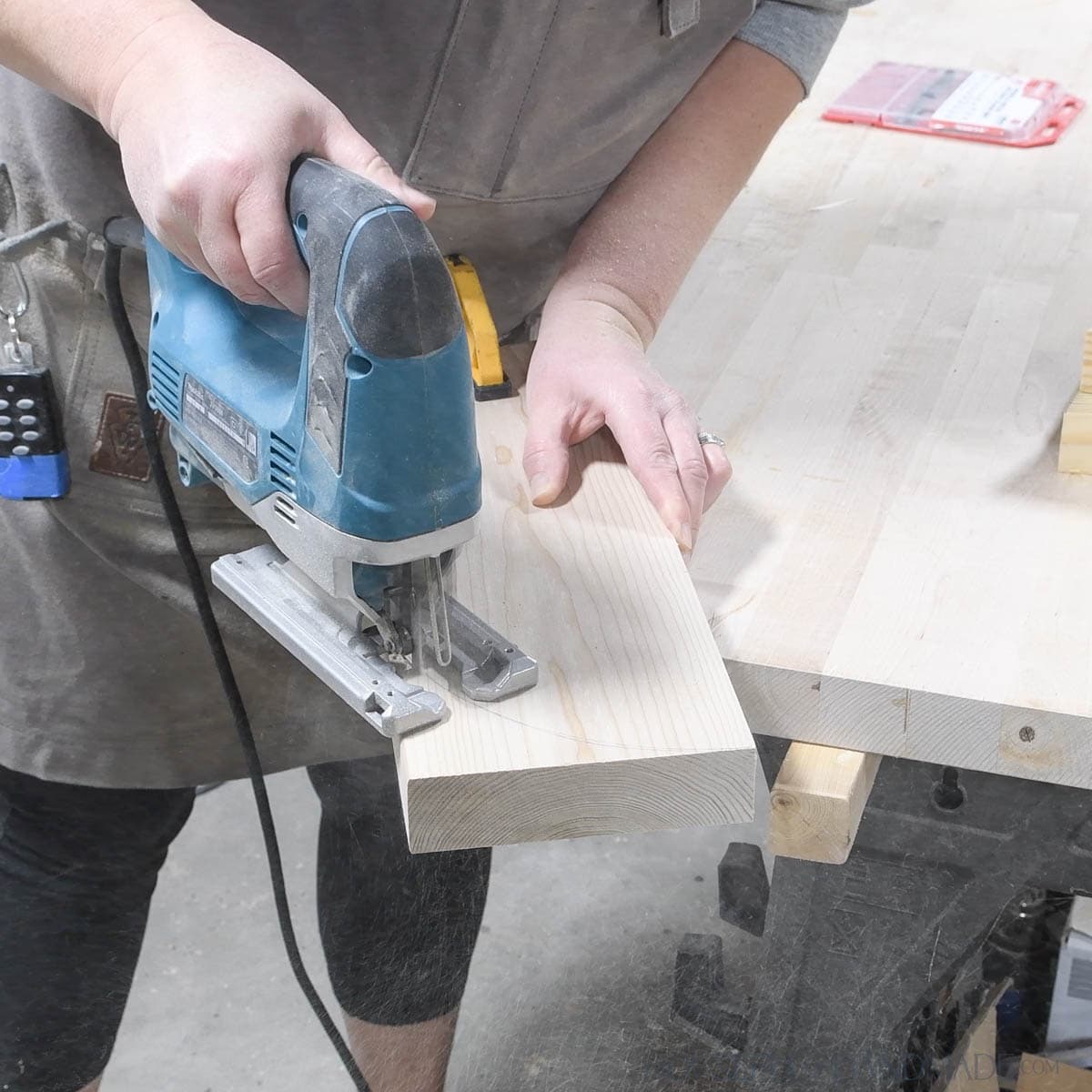 Cutting a curve on the back of the feet board. 