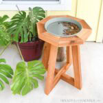 Cedar birdbath with modern pedestal bottom and octagon top.