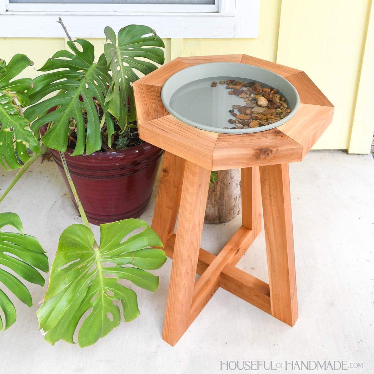 Cedar birdbath with modern pedestal bottom and octagon top.