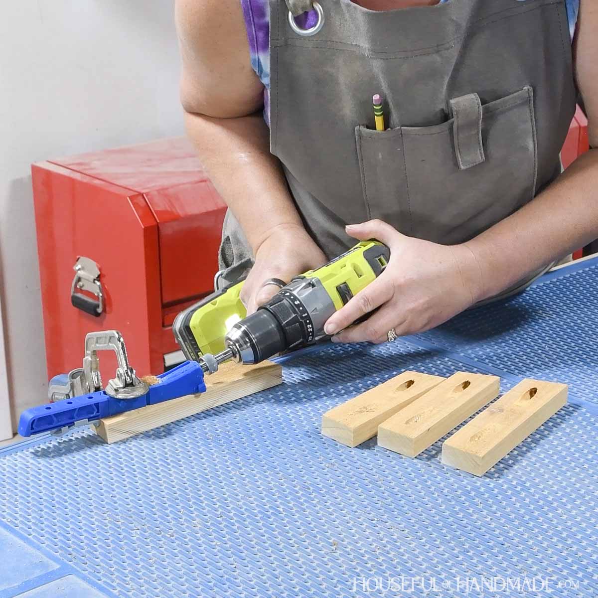 Drilling pocket holes in the 1x2 slats with a small pocket hole jig. 