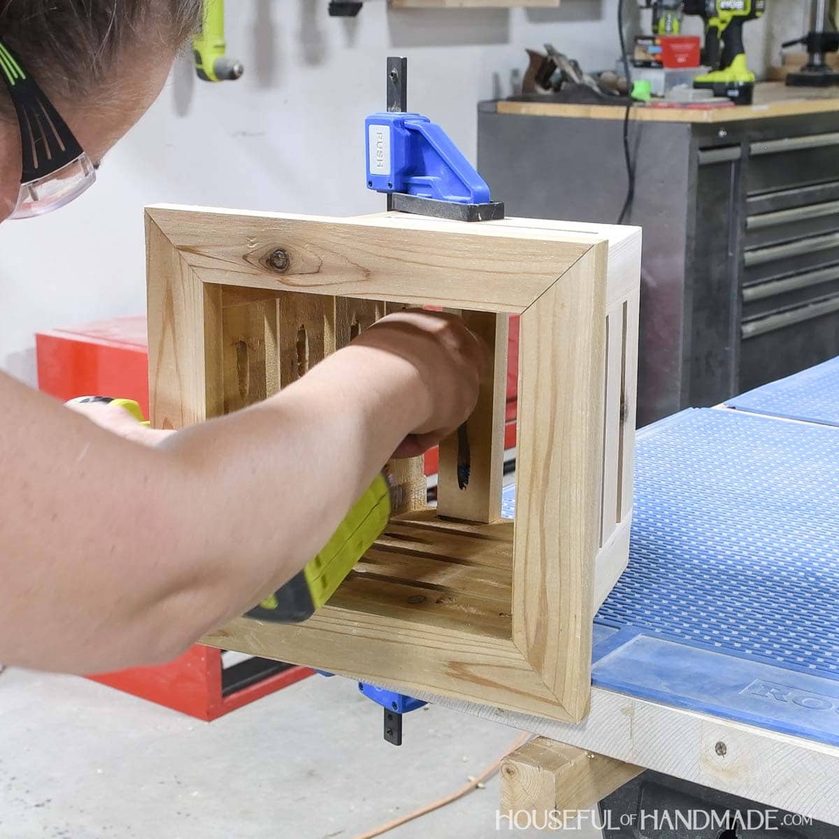 Attaching slats to the bottom of the planter with pocket holes. 