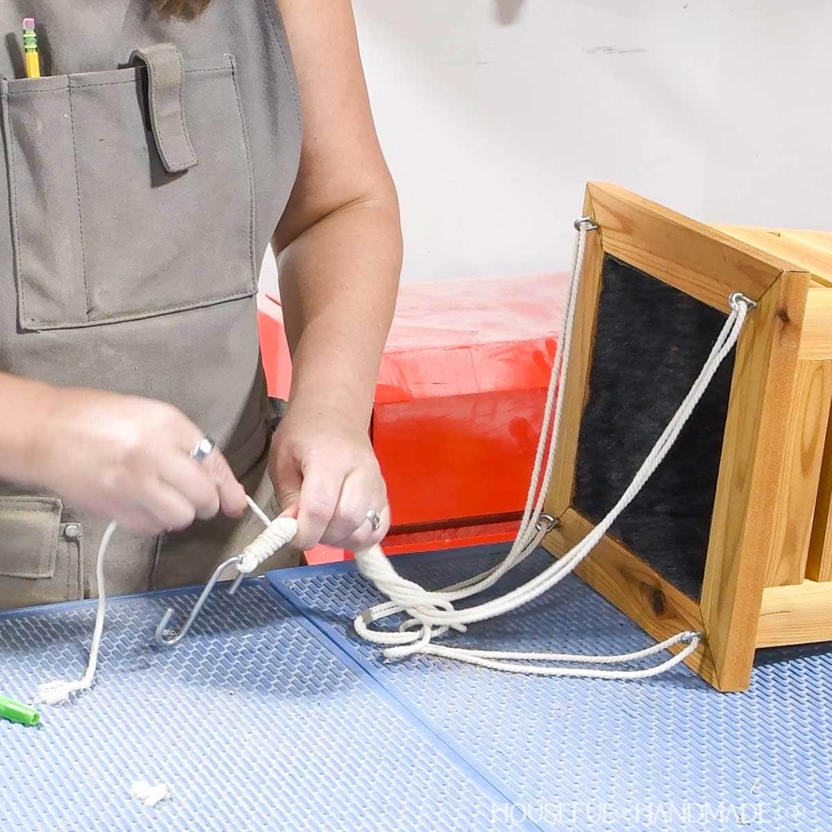 Adding cotton cord to the top to hang the planter. 