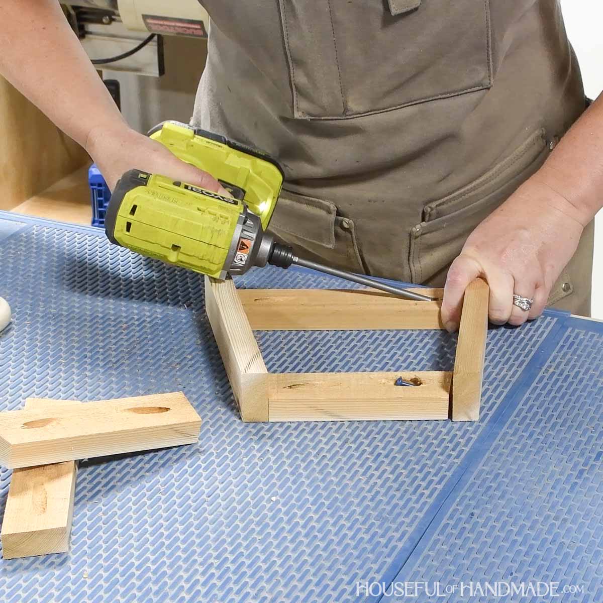 Adding the top and bottom slats between the corner pieces. 