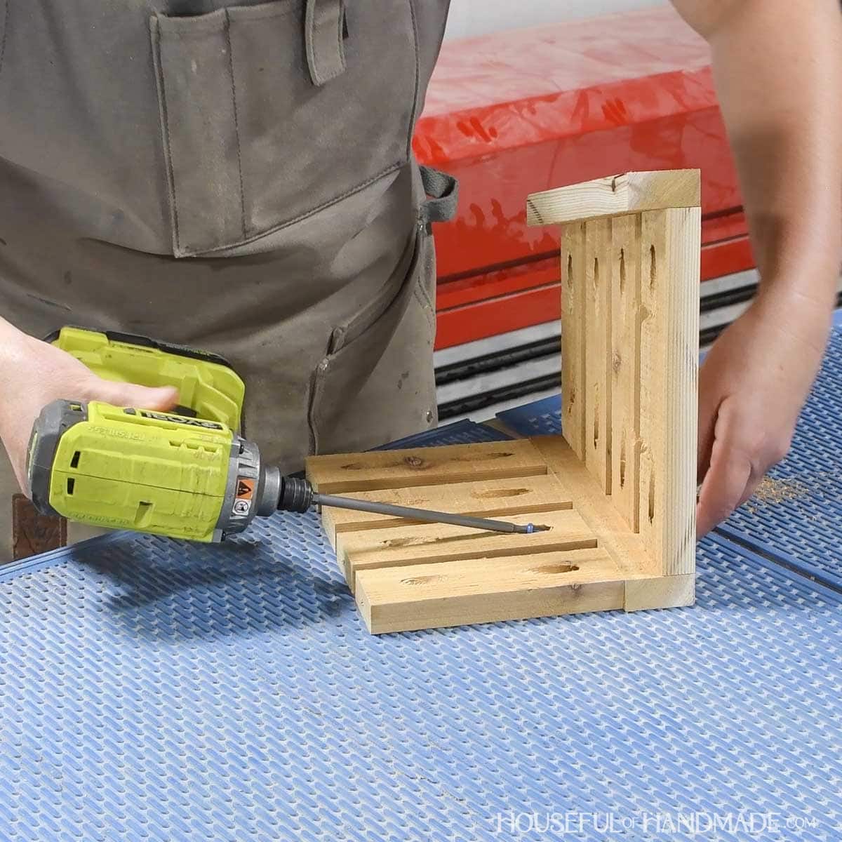 Adding slats to the side of the hanging planter. 