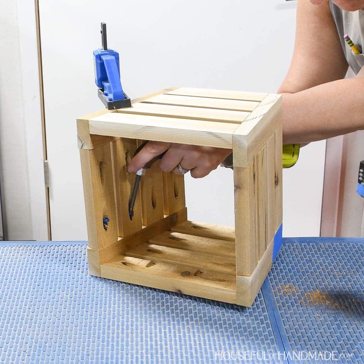 Attaching the front and back together with side slats. 