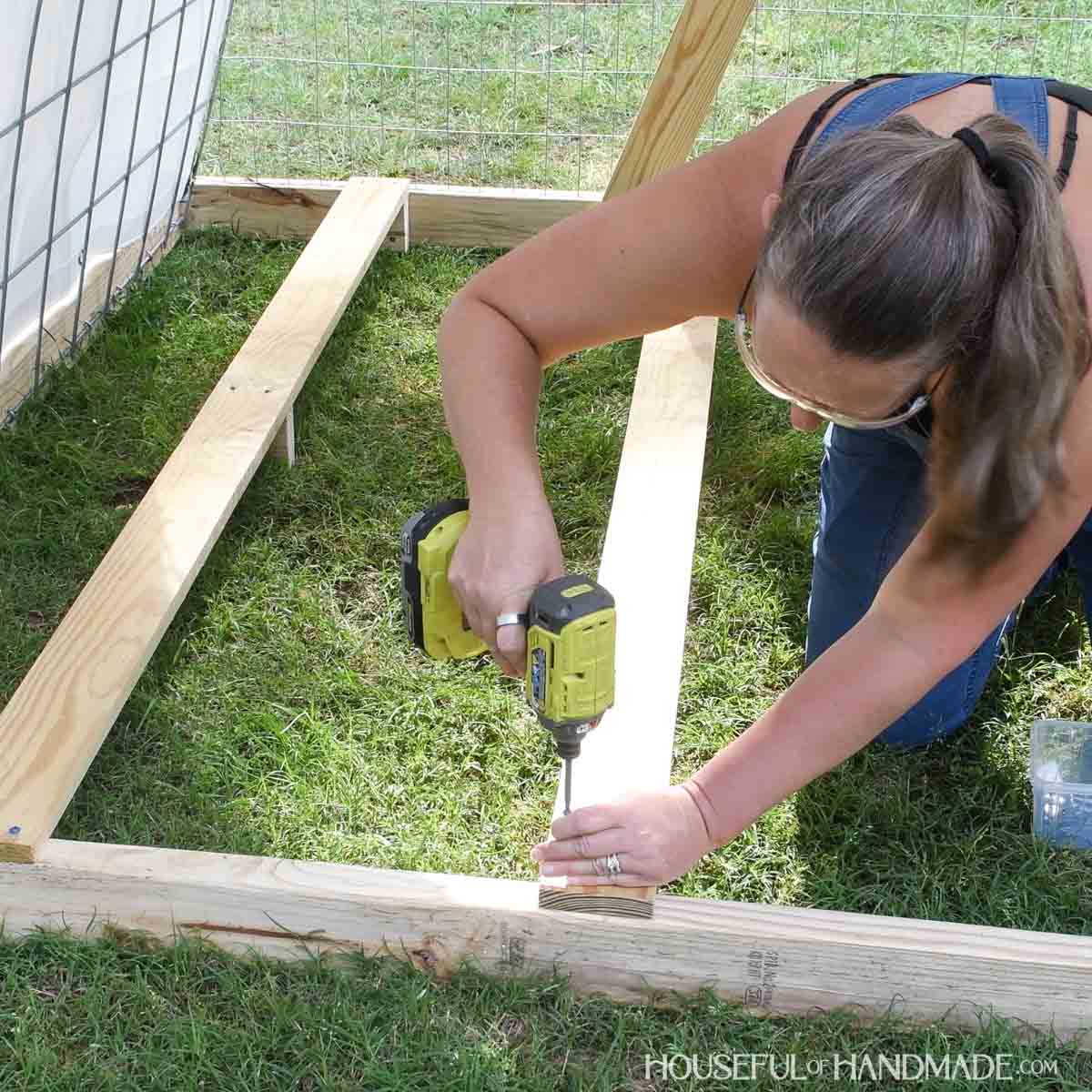 Adding roost bars inside the chicken tractor.