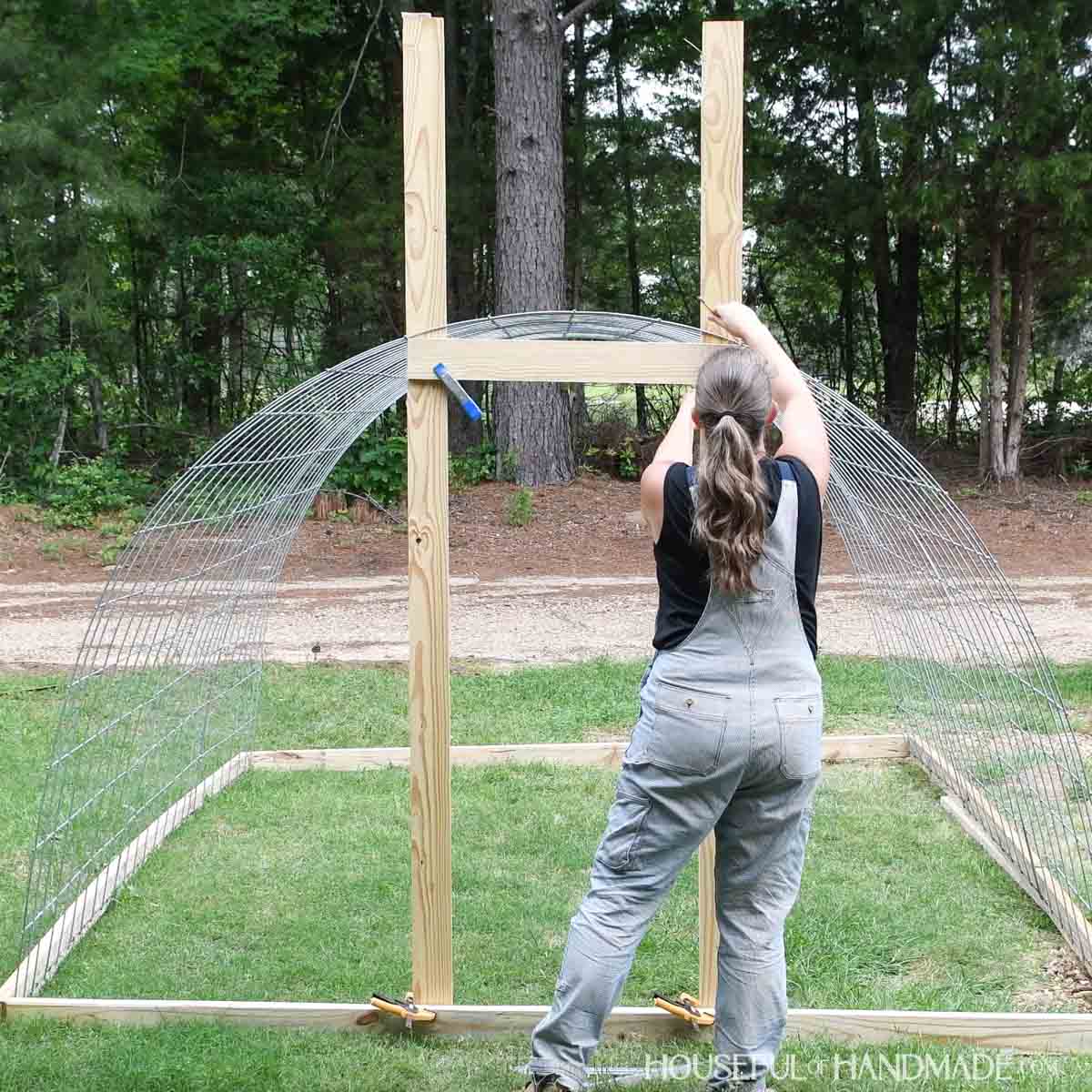 Drawing the curve of the hoop onto the boards for the door frame.