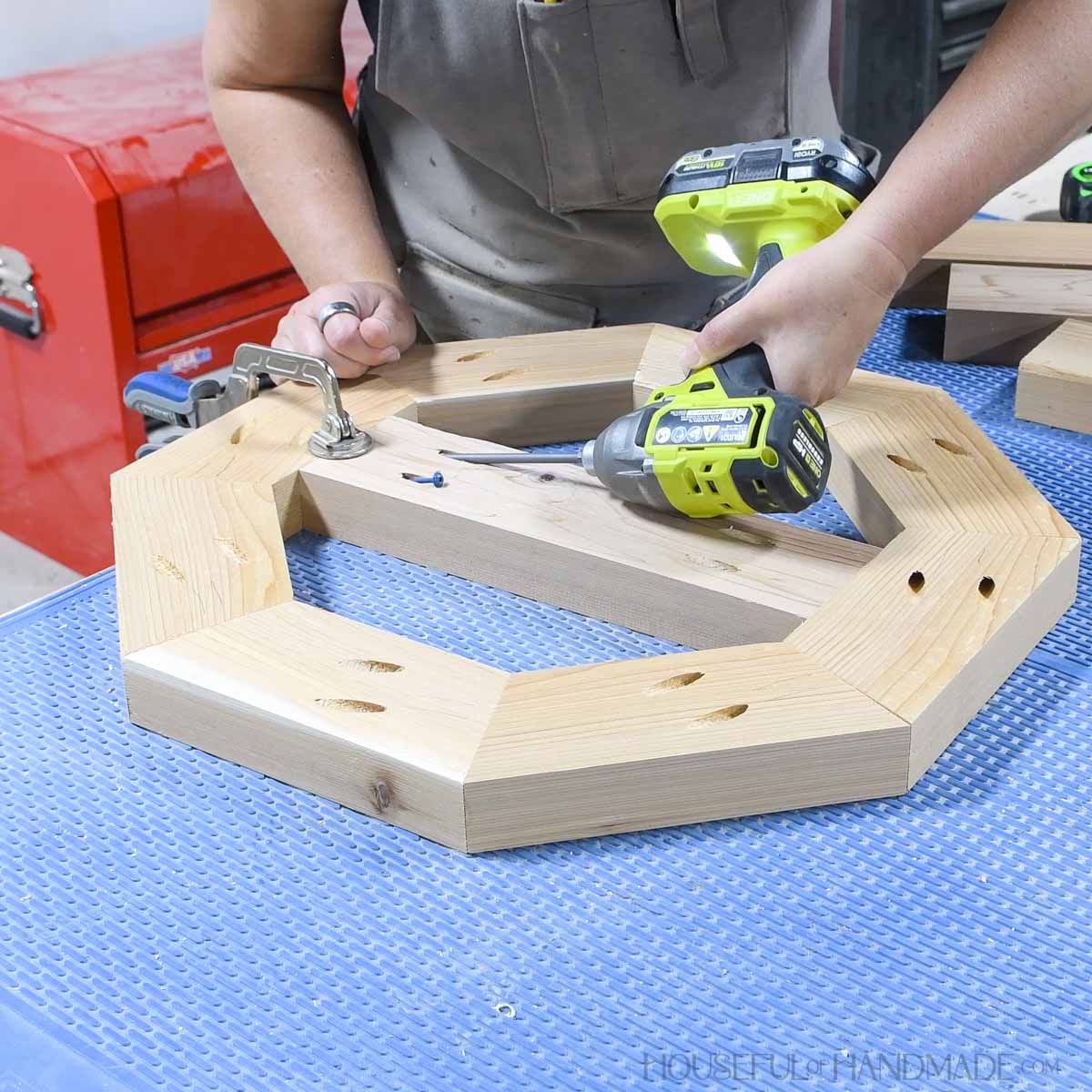 Adding a center board inside the octagon with pocket holes.