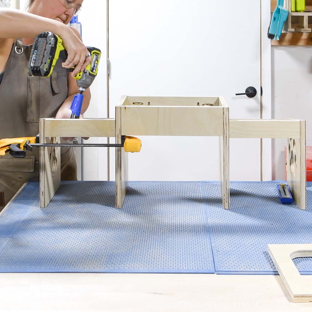 Attaching the sides to the dog bowl stand.