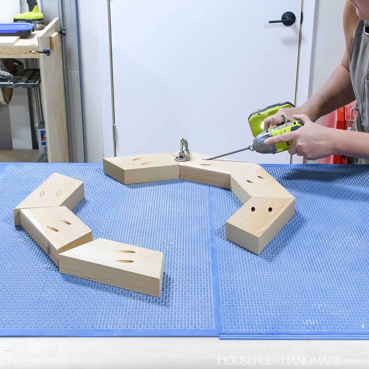 Attaching 2x4 boards together with pocket hole screws to make an octagon.