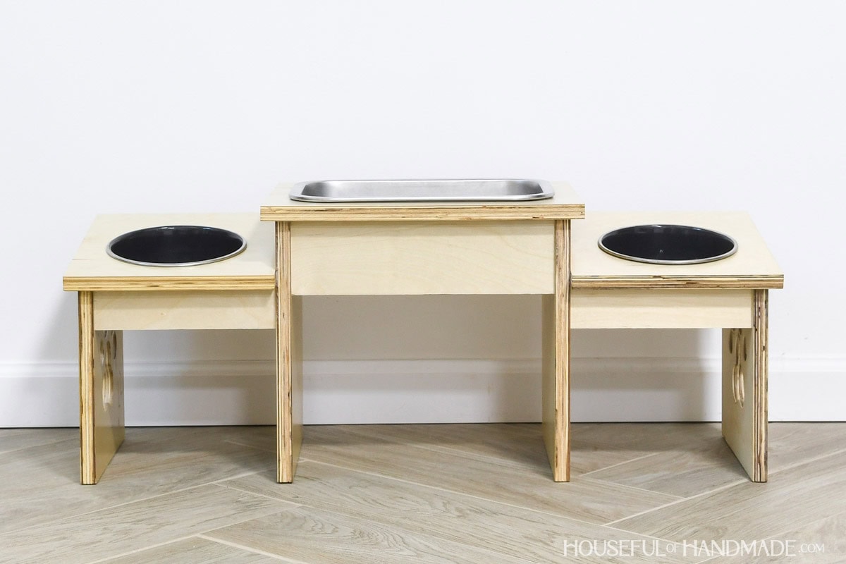 Double dog bowl stand with angled sides for food bowls.