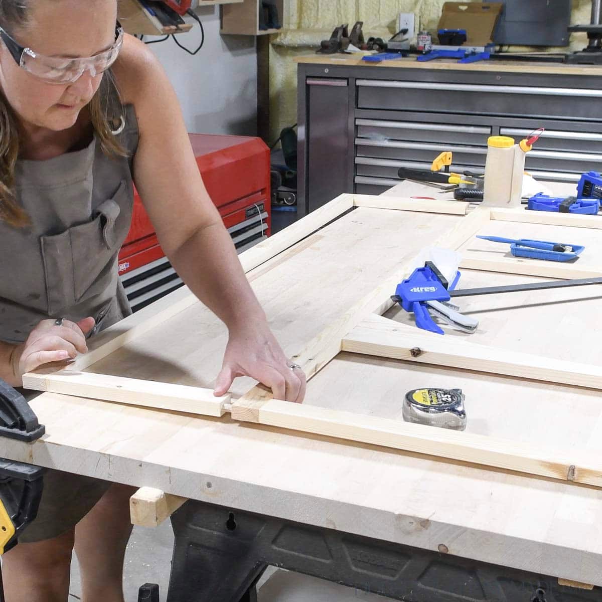 Attaching second cabinet face frame to side of the first. 