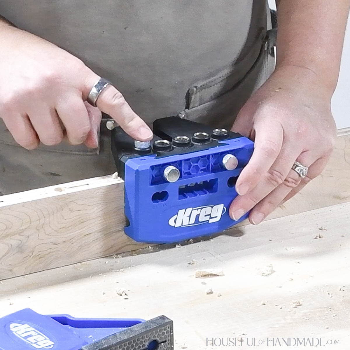 Placing index pin in hole for aligning the dowel jig. 