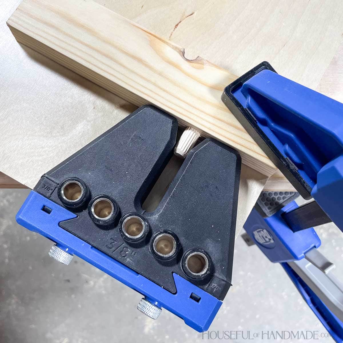 Aligning dowel pins with the dowel positioning groove on the jig. 