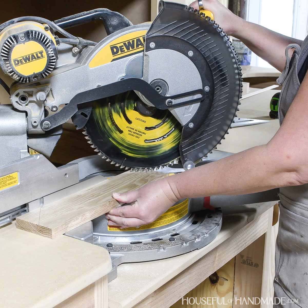 Cutting an angled cut on the miter saw.