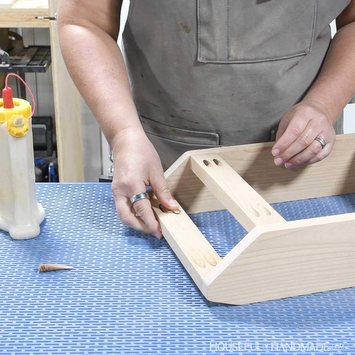 Filing pocket holes with custom plugs.