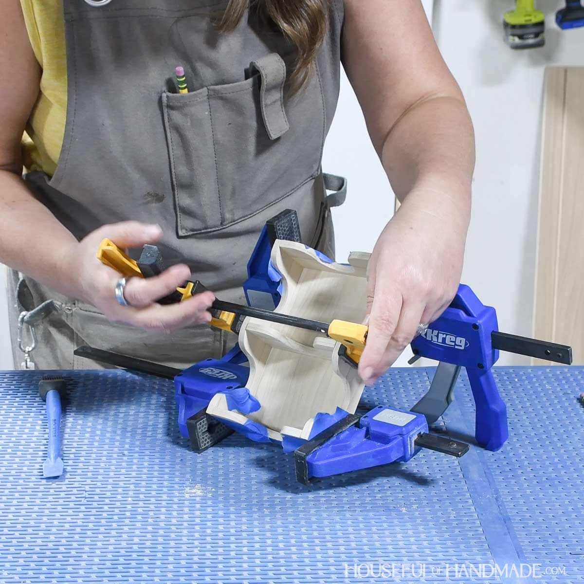 Clamping the pieces of the playing card holder together. 