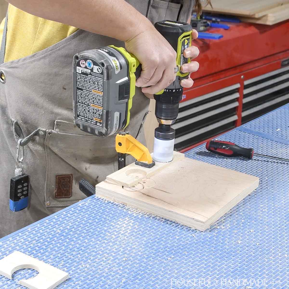 Using a hole saw to cut the curve on the card tray sides. 