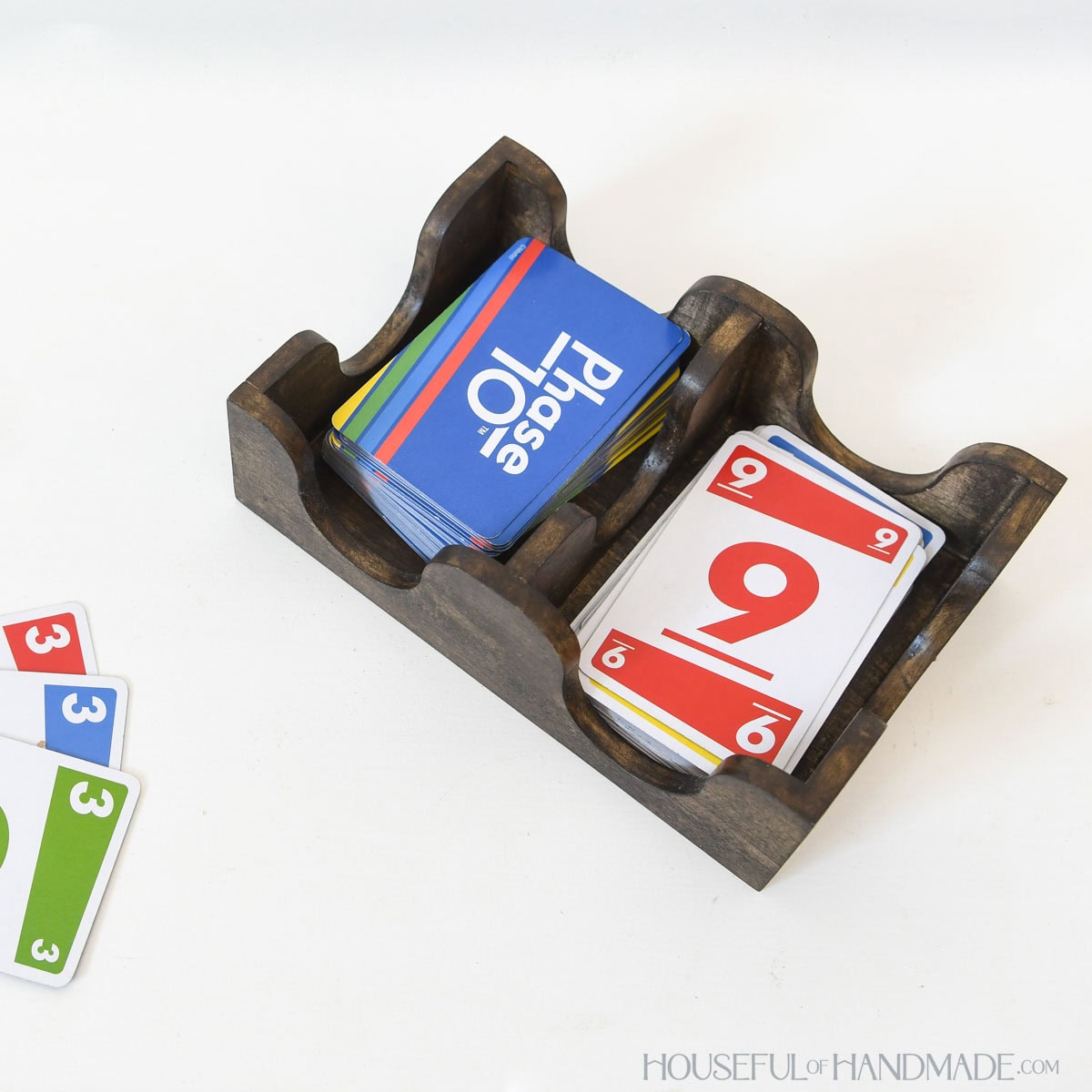 DIY playing card tray stained dark walnut with card game inside.