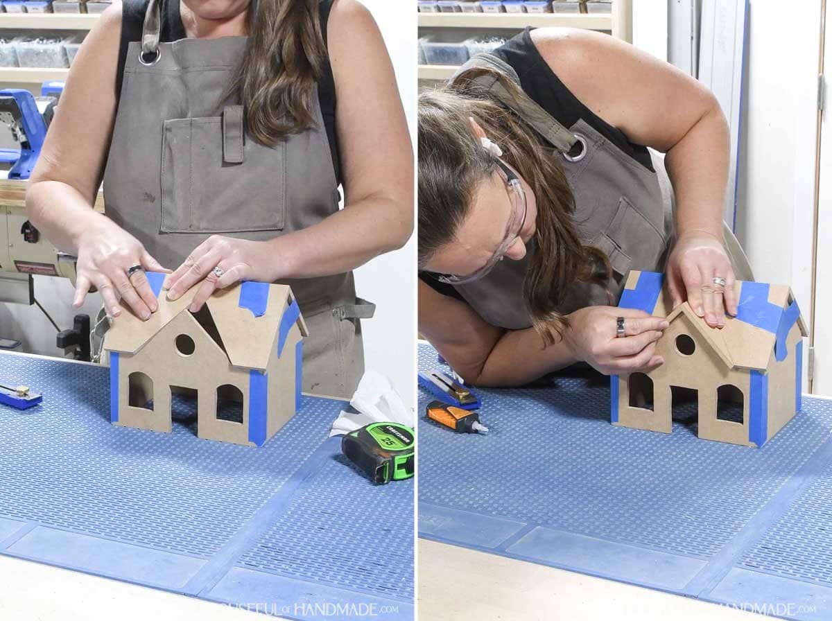 Glueing the roof and gable peak on a wide gingerbread house. 