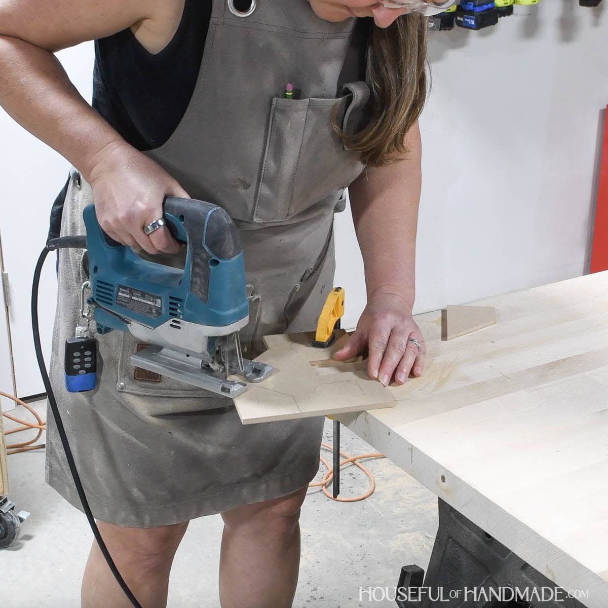 Cutting the house shape with a jig saw. 