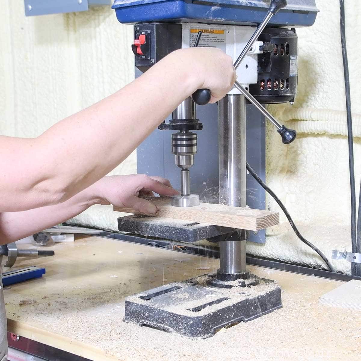 Drilling flat trays in the wood with a forstner bit.