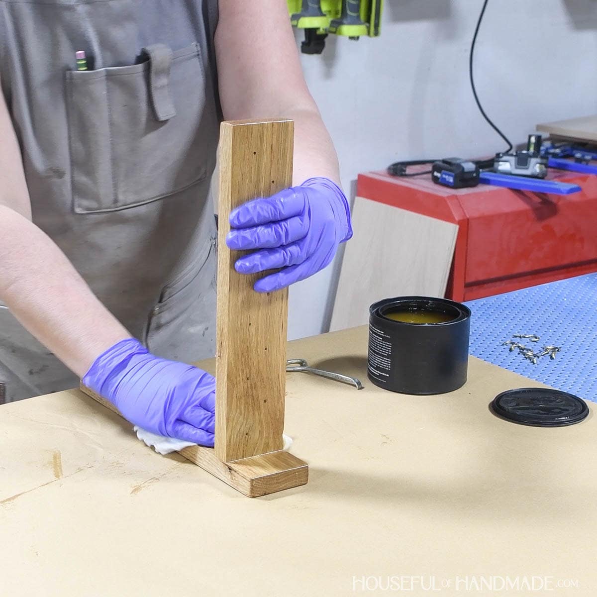 Sealing the wood jewelry organizer with furniture butter.