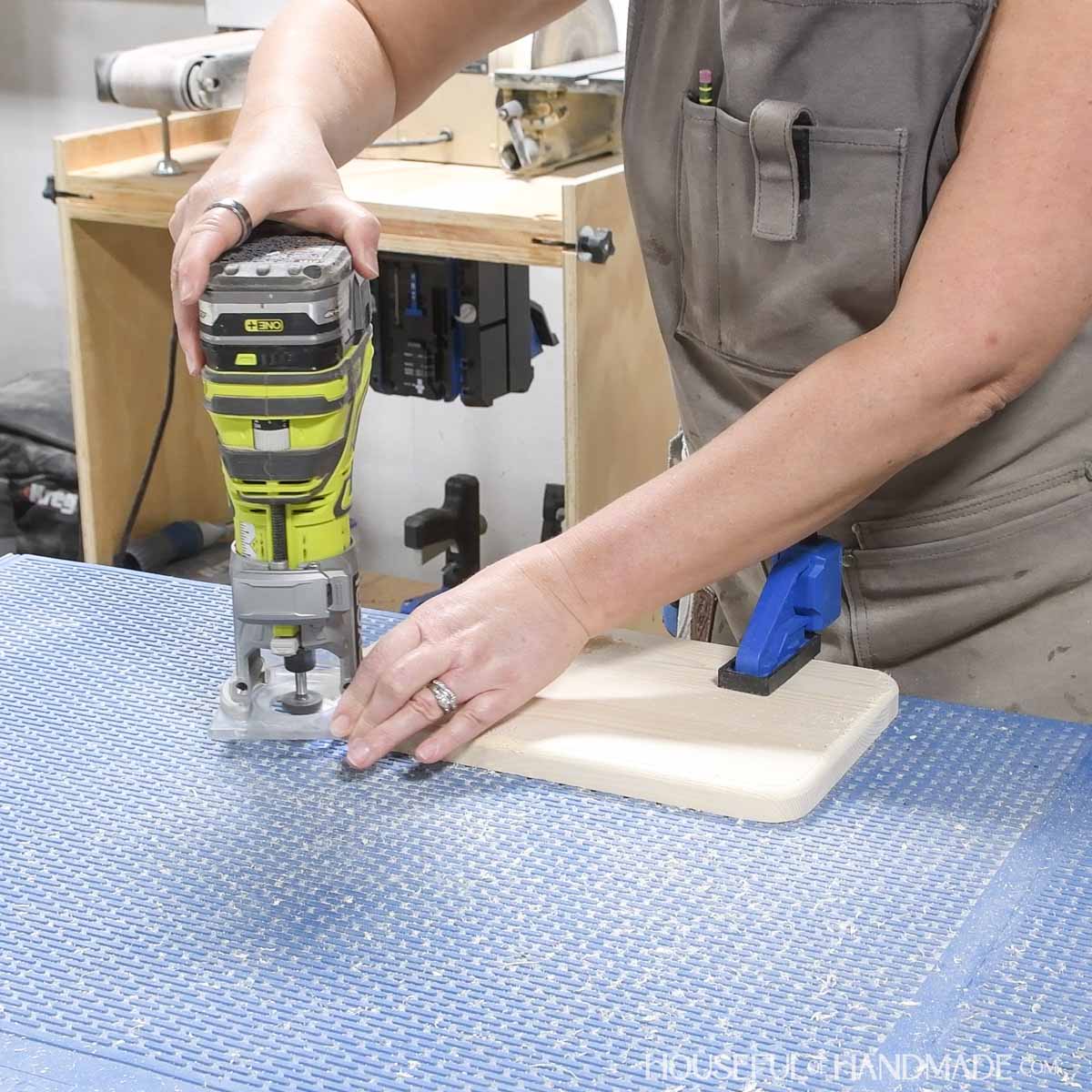 Adding round over to the top of the base with a trim router.