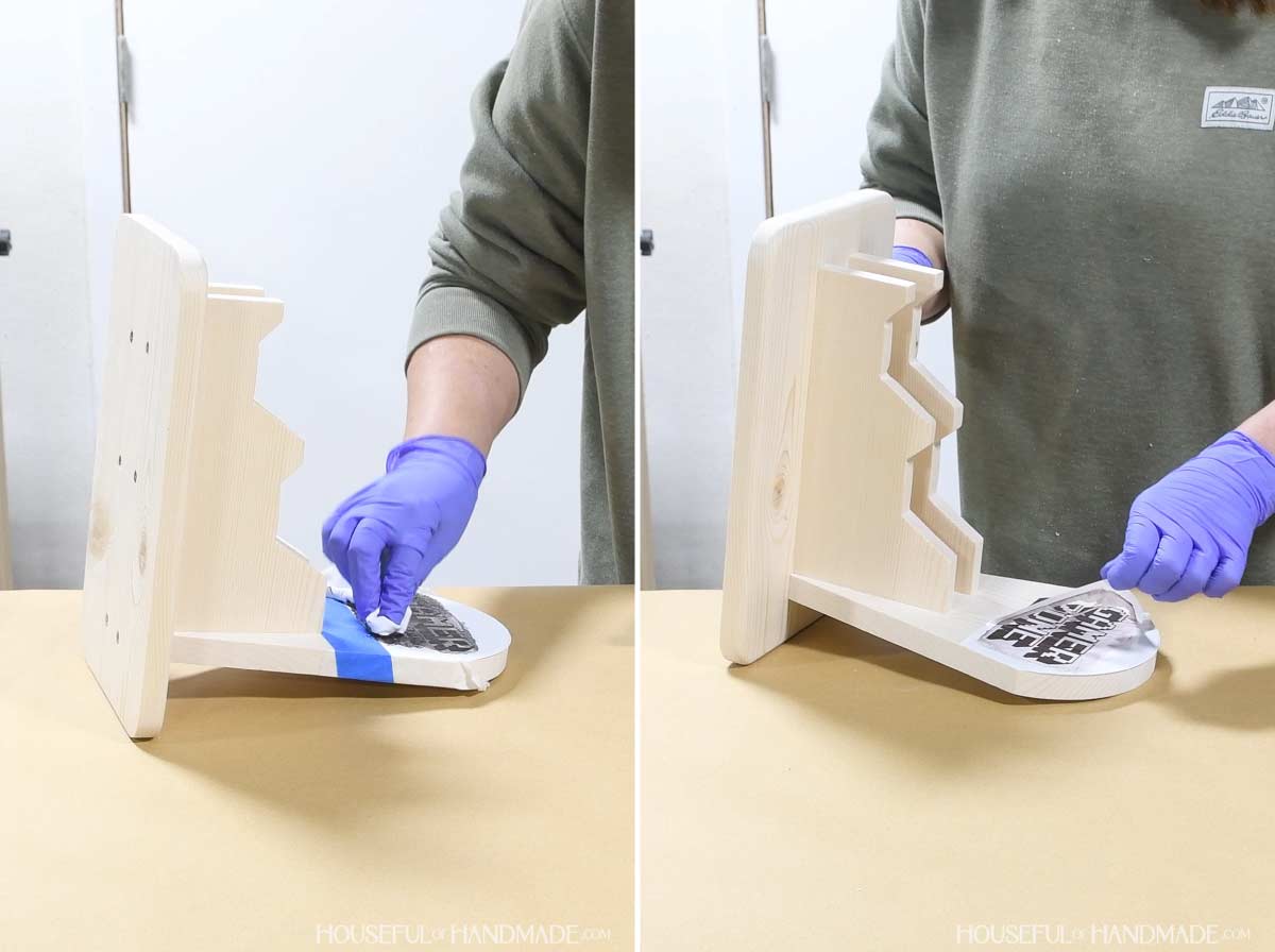 Adding design with vinyl stencil to front of game controller stand.