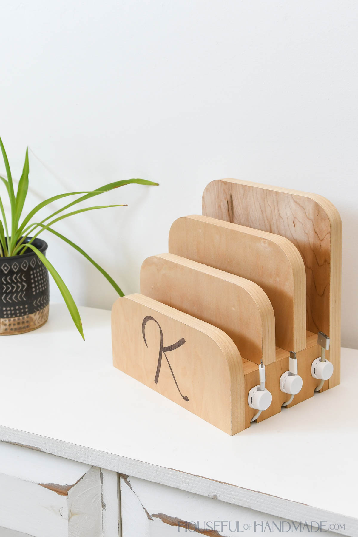 Easy DIY charging station to sit on a table or desktop with slots for 3 devices to charge.