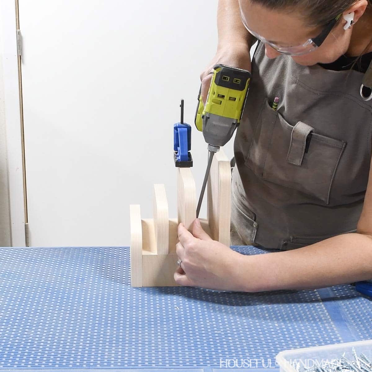 Securing the center dividers with pocket hole screws.